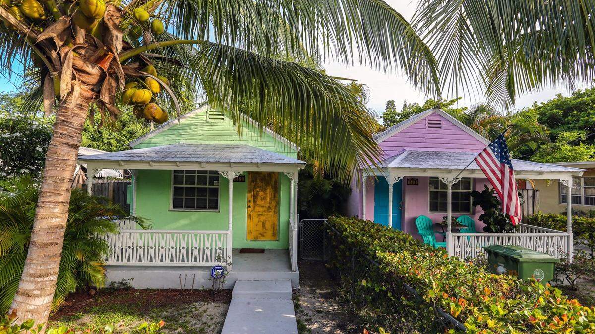 A pair of century-old wood-frame cottages still stand in Miami’s historically Black West Coconut Grove on Thursday, June 16, 2022. The mostly low-income community is disappearing amid accelerating gentrification.