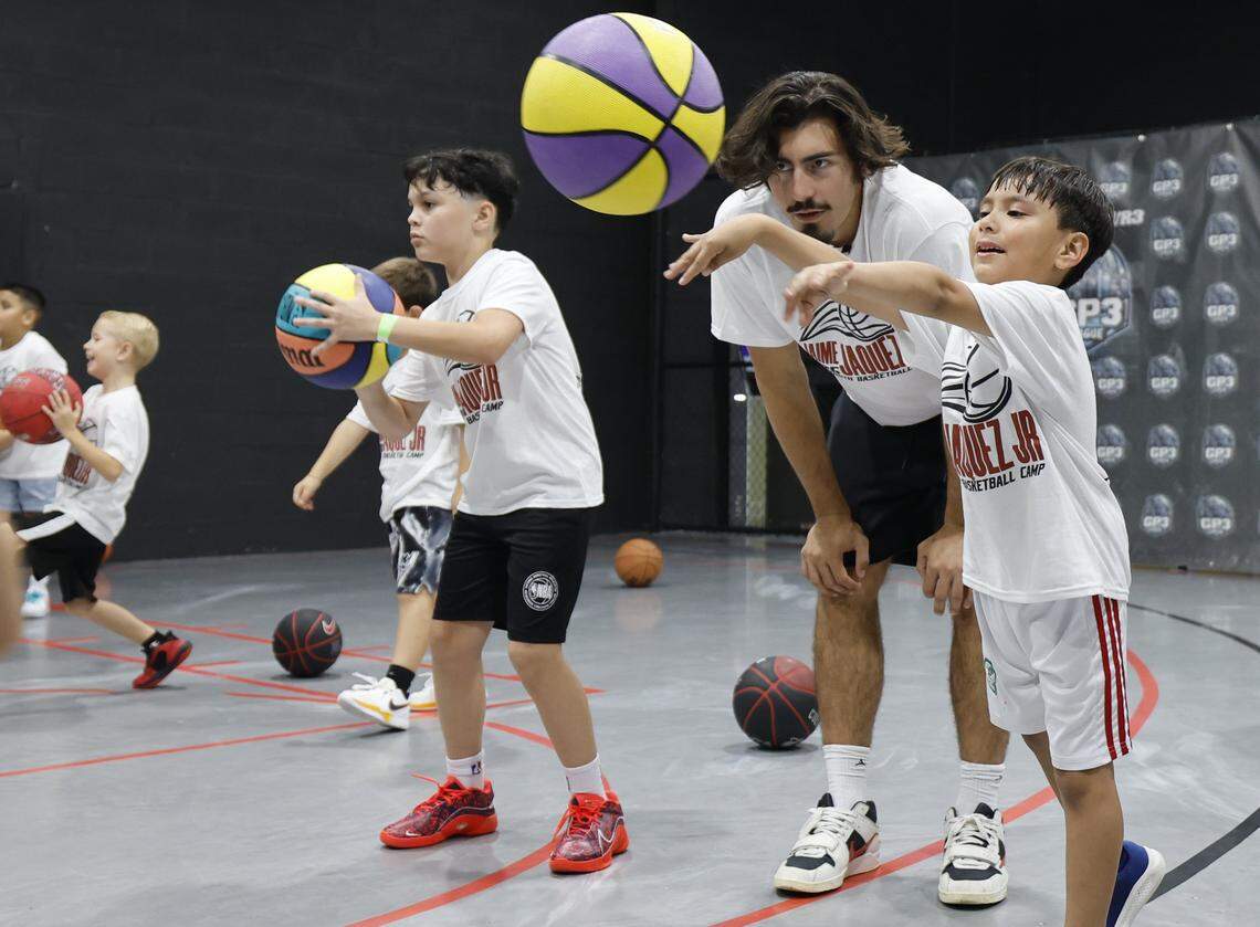 Miami Heat forward Jaime Jaquez Jr. coaches Miquel Lucas, 6, at his youth basketball camp at Game Point Miami, in Hialeah, Florida, on Saturday, August 16, 2025. 