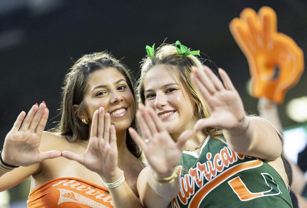 Miami Hurricanes fans throw up the U as their team plays against the Bethune-Cookman Wildcats in the first half of their NCAA football game at Hard Rock Stadium on Sept. 6, 2025, in Miami Gardens, Fla.