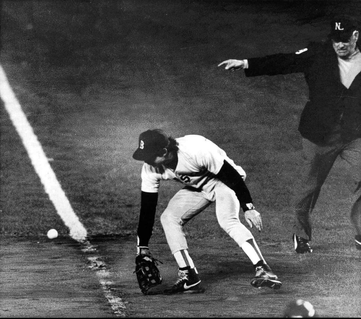 Boston Red Sox first baseman Bill Buckner misplays the ball during during Game 6 of the World Series against the New York Mets. Buckner, a star hitter who became known for making one of the most infamous plays in major league history, has died. He was 69. Buckner’s family said in a statement that he died Monday, May 27, 2019, after a long battle with dementia.
