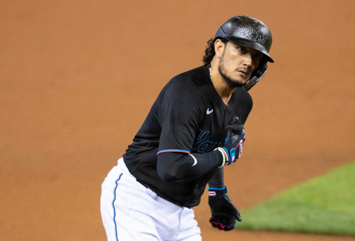 Miami Marlins short stop Miguel Rojas (19) reacts after homering on a fly ball to left center field in the first inning of a Major League Baseball game against the Washington Nationals at Marlins Park in Miami, Florida on Saturday, September 19, 2020.