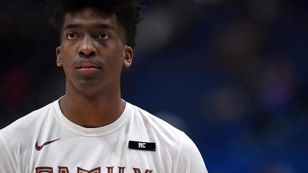 Florida State’s Terance Mann (14) wears a patch with the initials MC for Michael Cofer, the father of teammate Phil Cofer who passed away as the team warms up before a second round men’s college basketball game against Murray State in the NCAA tournament, Saturday, March 23, 2019, in Hartford, Conn.