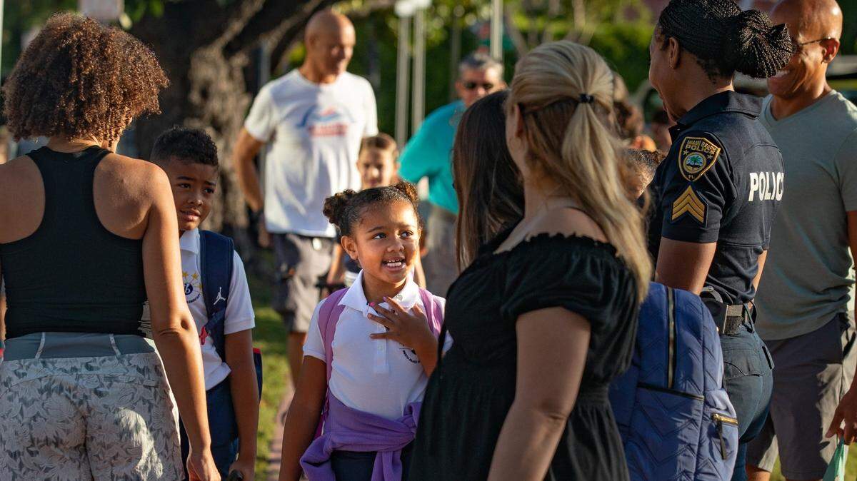 Students enter campus from the bus loop on the first day of school at Miami Beach High in Miami Beach, Florida on Aug. 17, 2022. In April, the district officially became the third-largest school district in the country.