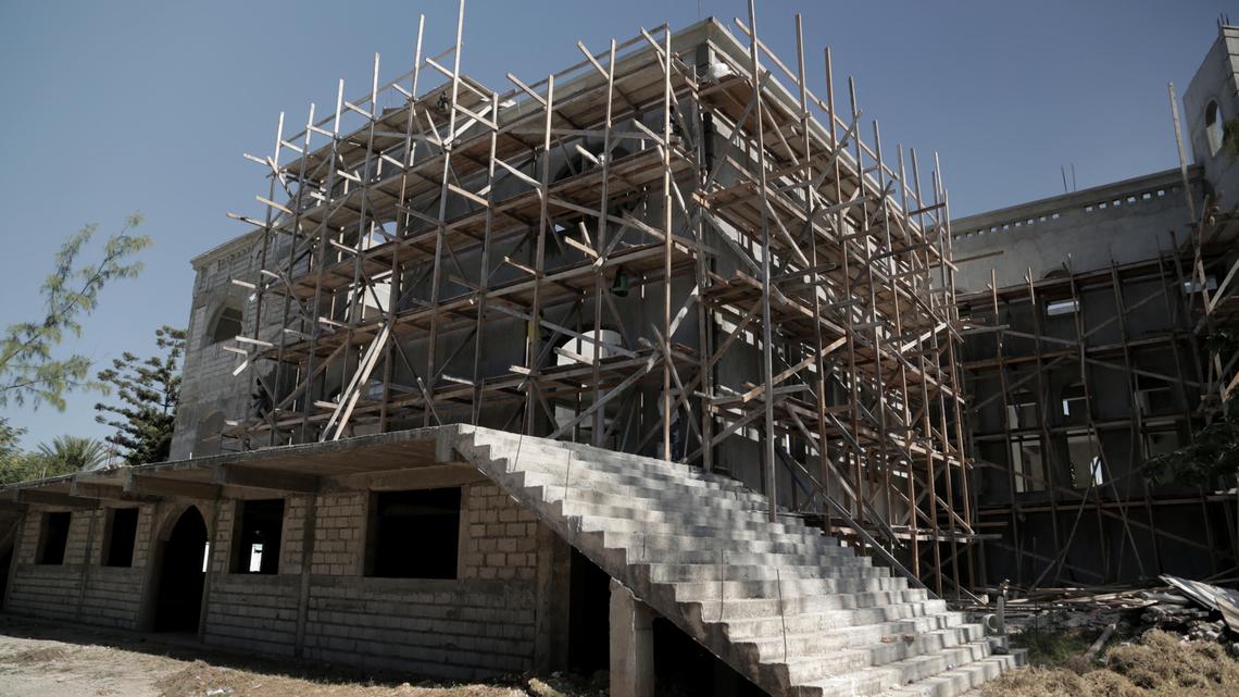 Scaffolding lines the outside wall of Notre-Dame du Perpétuel Secours in Delmas’ Fragneauville neighborhood. The parish priest said everything including the massive concrete dome has been built to earthquake code.
