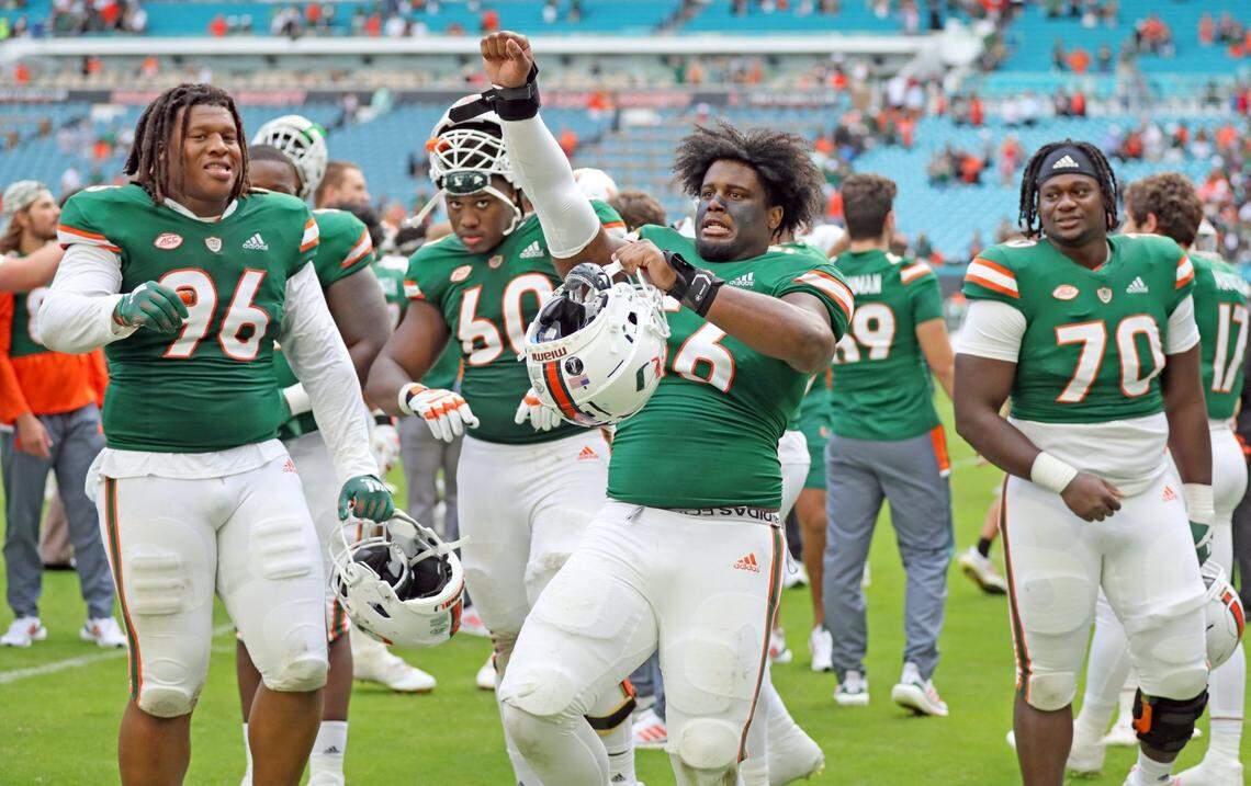 Miami Hurricanes defensive lineman Leonard Taylor (56) celebrates with teammates after the Canes defeat Georgia Tech at Hard Rock Stadium in Miami Gardens on Saturday, November 6, 2021