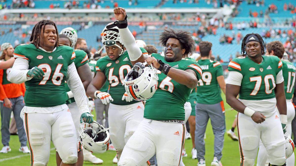 Miami Hurricanes defensive lineman Leonard Taylor (56) celebrates with teammates after the Canes defeat Georgia Tech at Hard Rock Stadium in Miami Gardens on Saturday, November 6, 2021