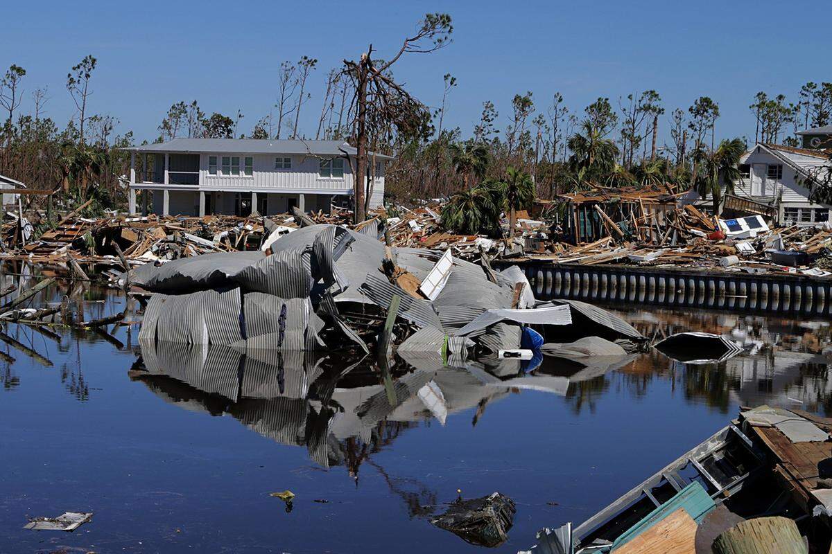 Metal roofs were peeled off houses and blown into a marina in Mexico Beach, where Hurricane Michael inflicted some of its worst damage.