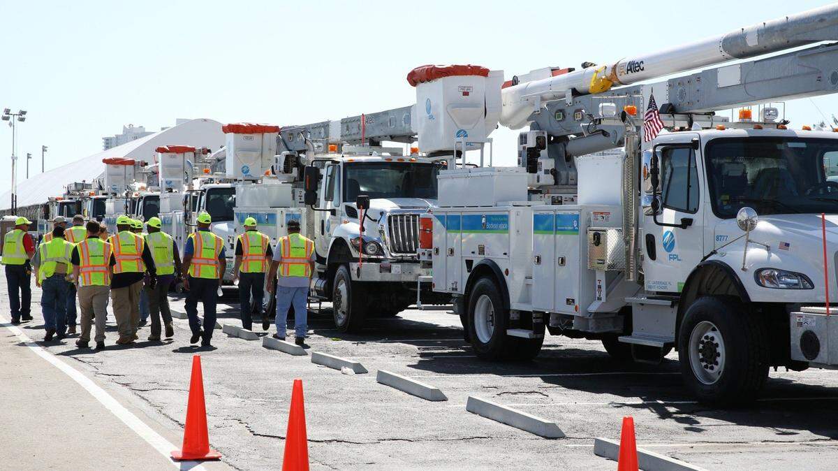FPL personnel walk through the bucket truck area in a drill for the 2015 hurricane season at Gulfstream Park in Hallandale Beach on Wednesday, April 15, 2015.