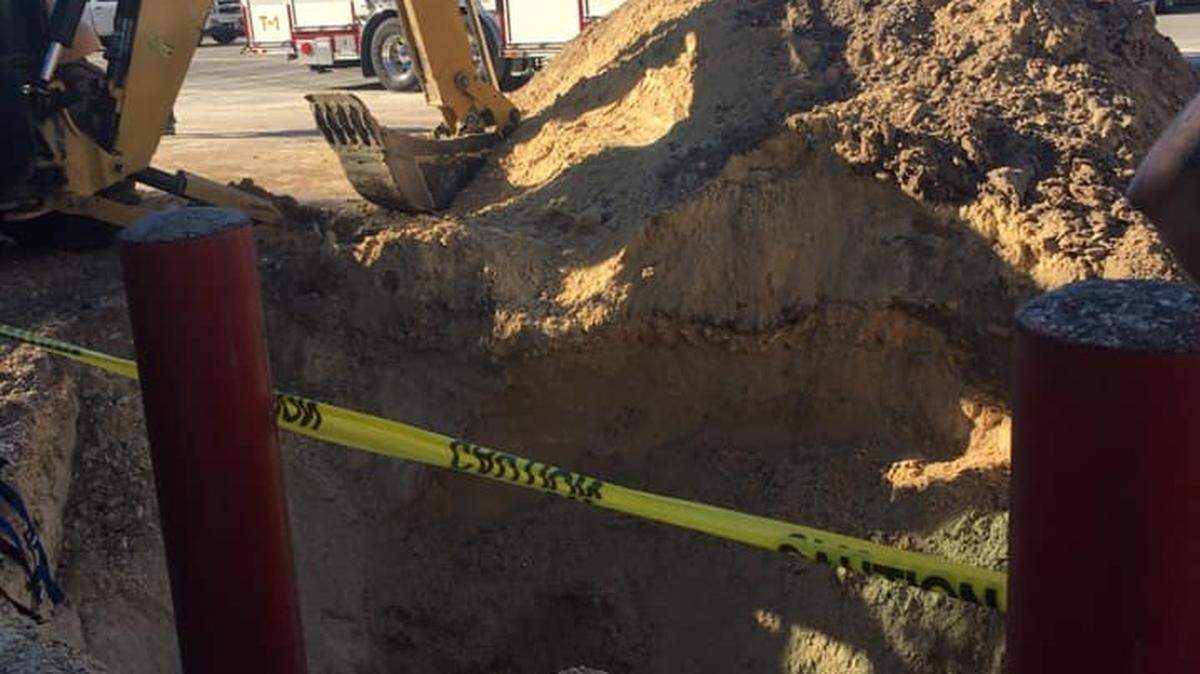 Gainesville Fire Rescue crews used a ladder and harnesses and shovels and hands to get inside a 10-foot by 25-foot hole into which a construction worker fell and was completely buried on Jan. 10, 2019.