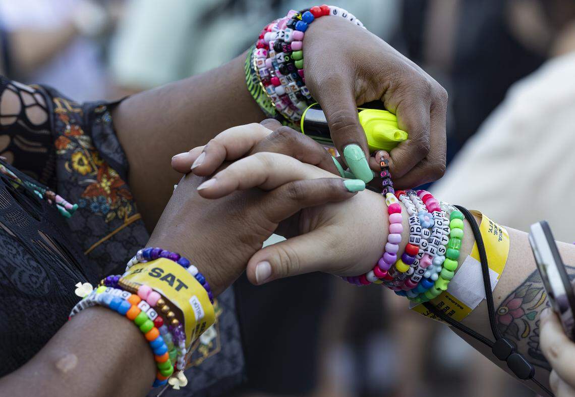 People share kandi bracelets as they attend Ultra Music Festival’s 26th anniversary at Bayfront Park on Saturday, March 28, 2026, in downtown Miami, Fla.