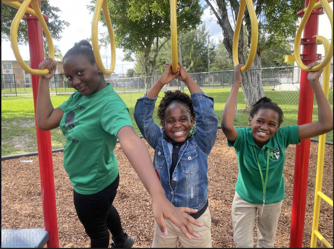 From left: Crystal Bell, Victoria Charles and Jaliyah Lewis play in the playground at Beacon College Preparatory on Oct. 20, 2022, as part of an after-school program with Girls Inc., a program that works with 180 underserved girls in Miami-Dade to build their academic skills, along with bolstering their self-awareness and confidence.