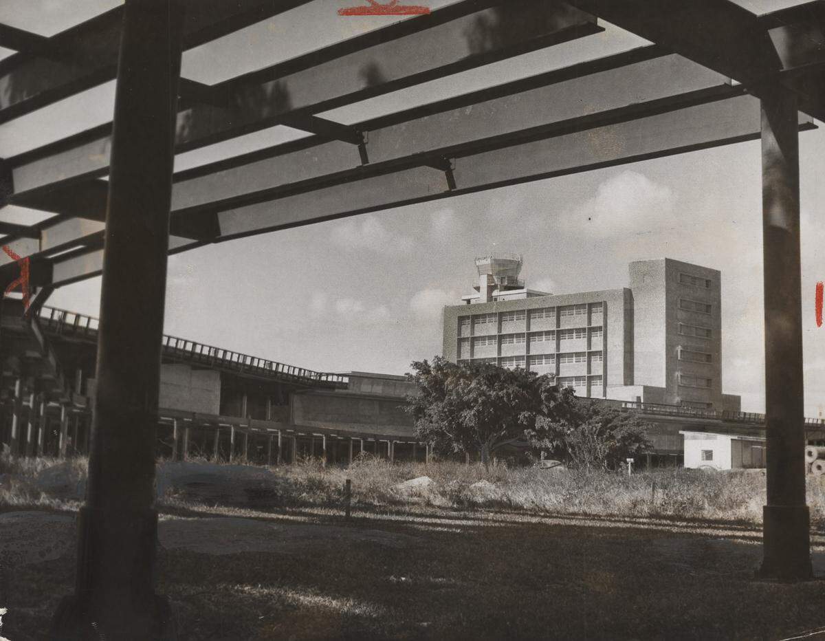 View from the Southeast, under an unfinished overhead roadway as a terminal nears completion at the Miami airport in 1957.