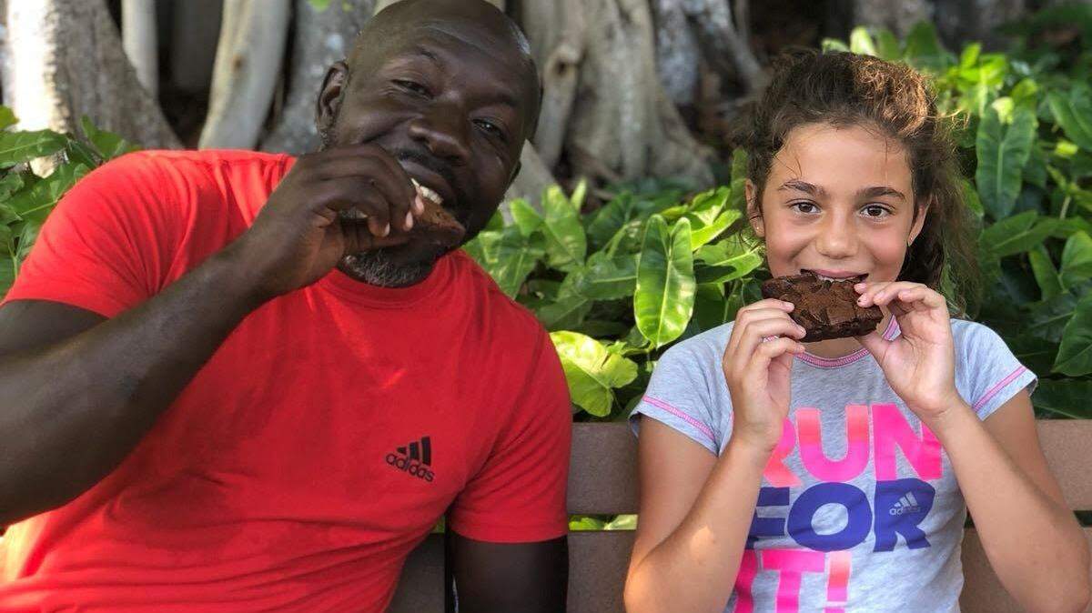 Biltmore Tennis Center coach Juandell Brunner (left) suffered a stroke Oct. 17, 2018 and his 10-year-old student Emma Wiesenfeld helped raise $27,000 for his medical bills.