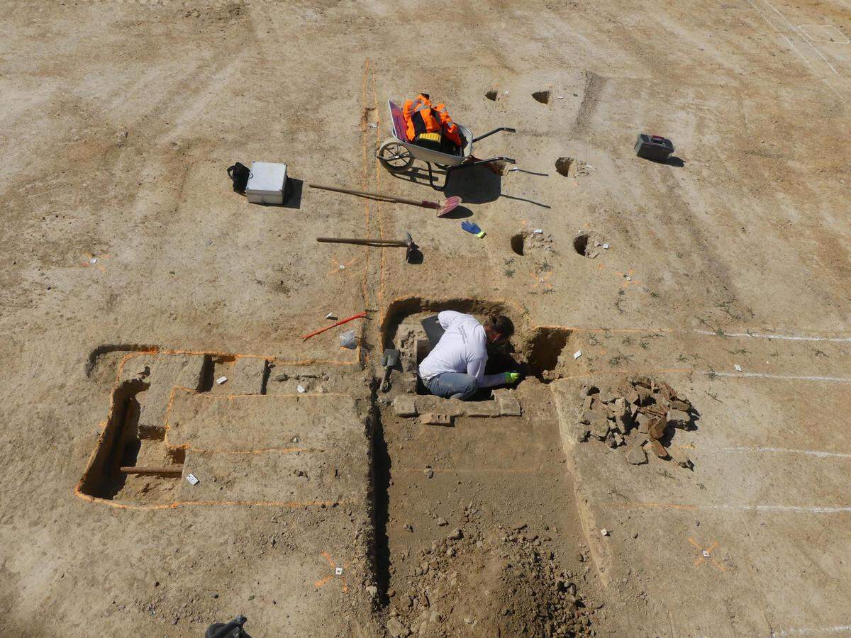 Archaeologists have found the remains of a section of buildings, as well as dump pits filled with personal items.