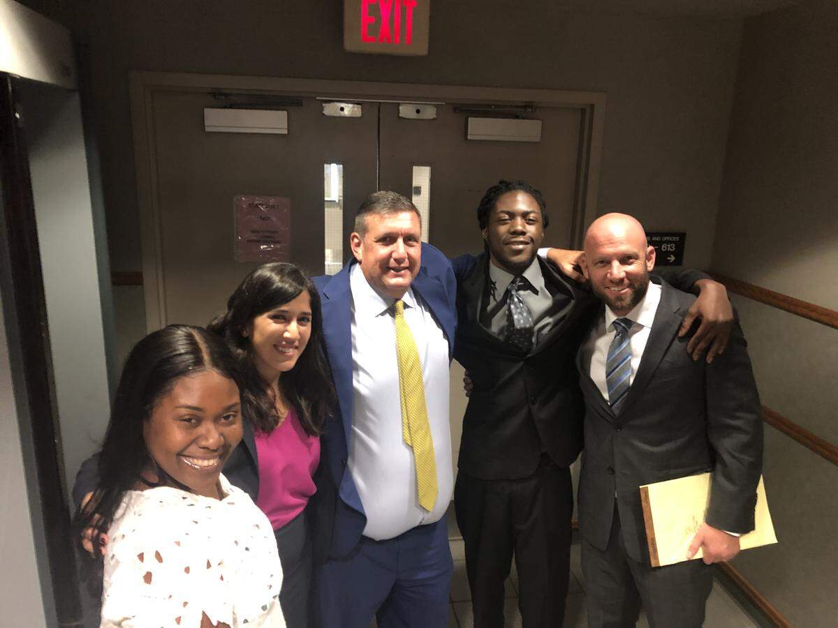 Christopher Walker, 19, flanked by supporters on Sept. 16, 2019, after prosecutors dropped a murder charge against him in the killing of 17-year-old Noricia Talabert. From left to right: Ain Walker, his mother; lawyer Carolle El-Naffy; defense lawyer Andrew Rier; Walker; and defense attorney Jonathan Jordan.