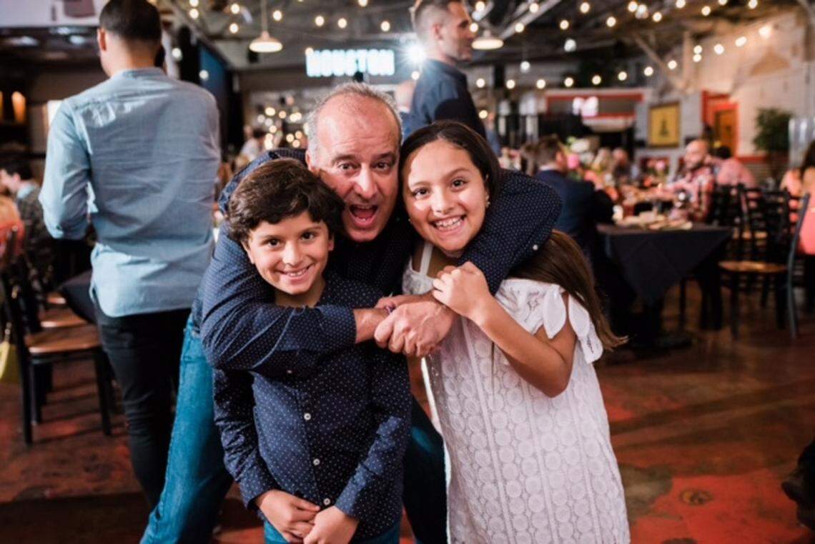 Manuel ‘Manny’ LaFont with his two children, Mia and Santi. LaFont, a beloved baseball coach, died in the Surfside condo collapse.