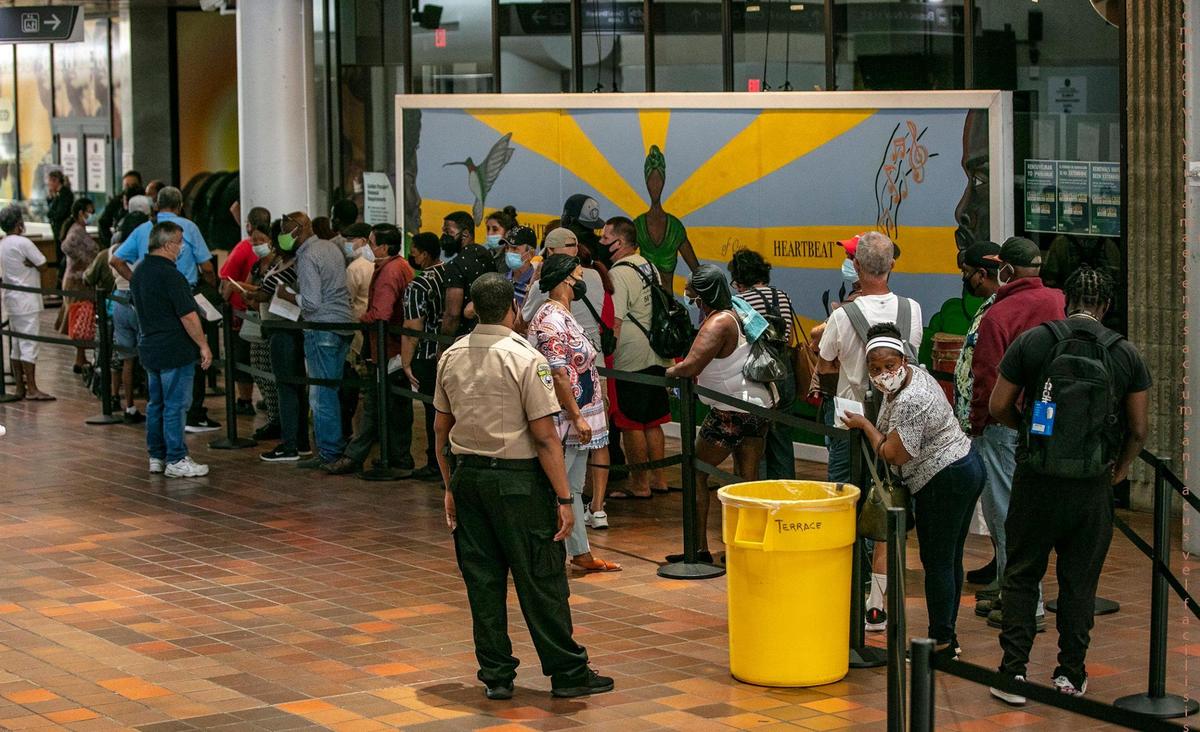 A large group of Miami-Dade residents lined up outside the building to enter the Golden Passport office to renew free transit passes on the office’s first day open since the pandemic started. The renewal office reopened Thursday, May 20, 2021, with a three-hour wait at the Stephen P. Clark Center. The county has extended the deadline for renewing the cards until Sept 30, but many people aren’t aware of the extension.
