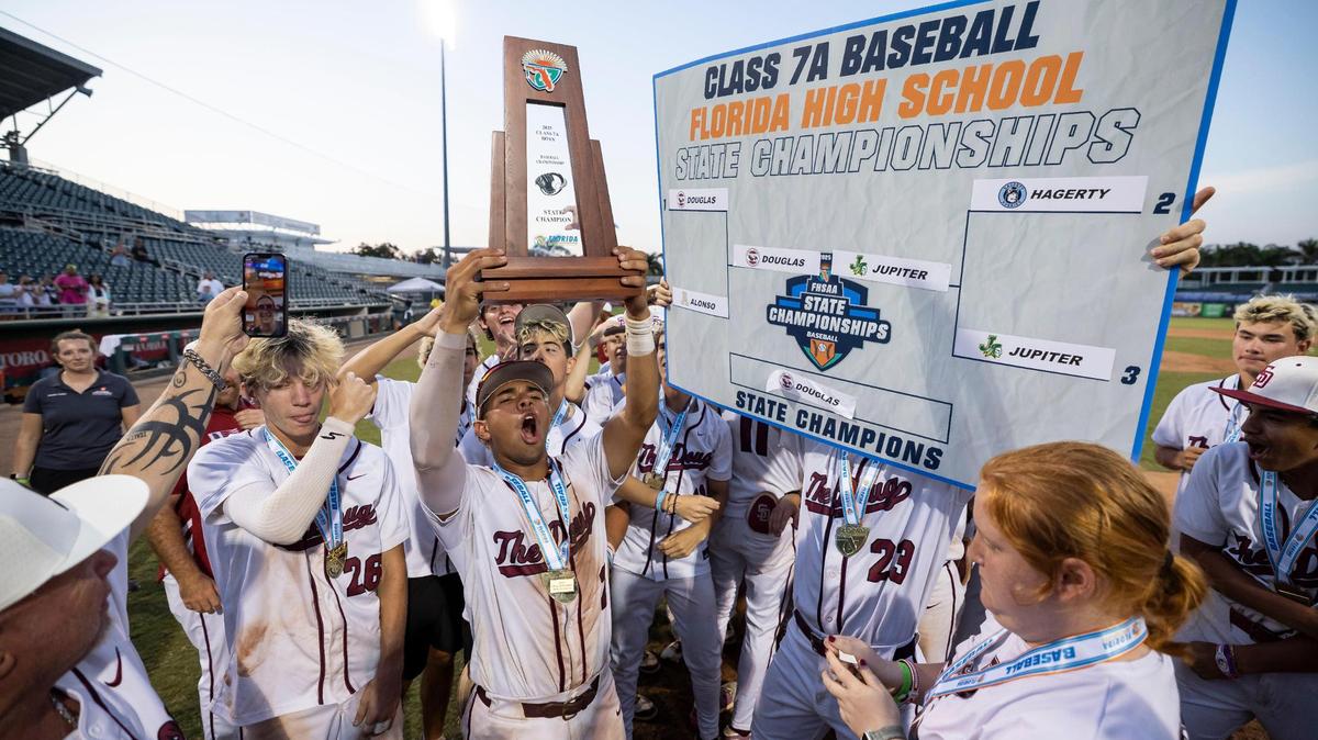 Stoneman Douglas Eagles celebrate after they defeated the Jupiter Warriors in their Class 7A state baseball championship game at Hammond Stadium on Saturday, May 17, 2025, in Fort Myers, Fla.