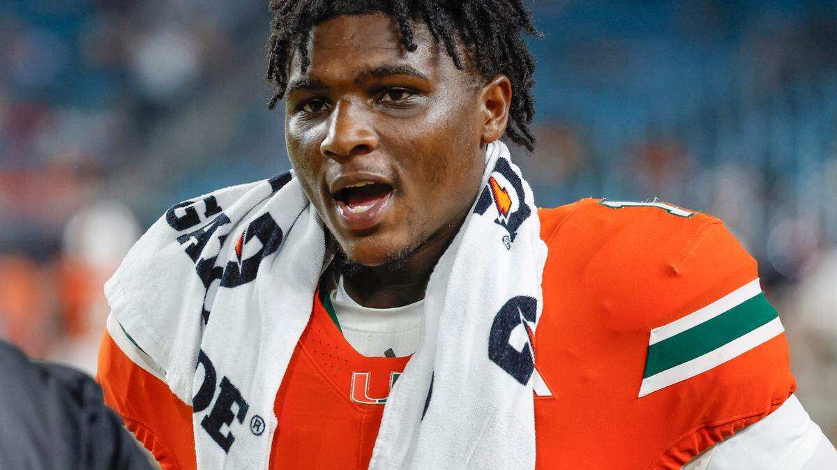 Miami Hurricanes quarterback Cam Ward (1) on the sidelines in the second half of an NCAA football game against the Ball State Cardinals at Hard Rock Stadium in Miami Gardens, Florida on Saturday, September 14, 2024.