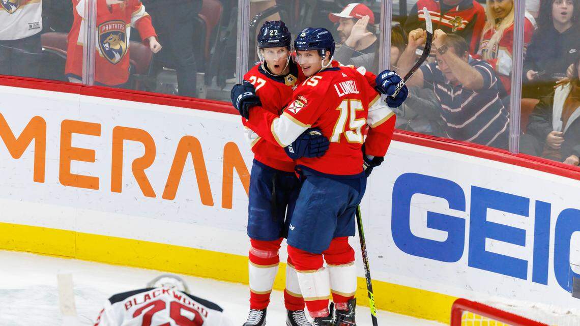 Florida Panthers center Eetu Luostarinen (27) celebrates with teammate Anton Lundell (15) after scoring a goal during the second period of an NHL game against the New Jersey Devils at FLA Live Arena on Wednesday, December 21, 2022 in Sunrise, Fl.