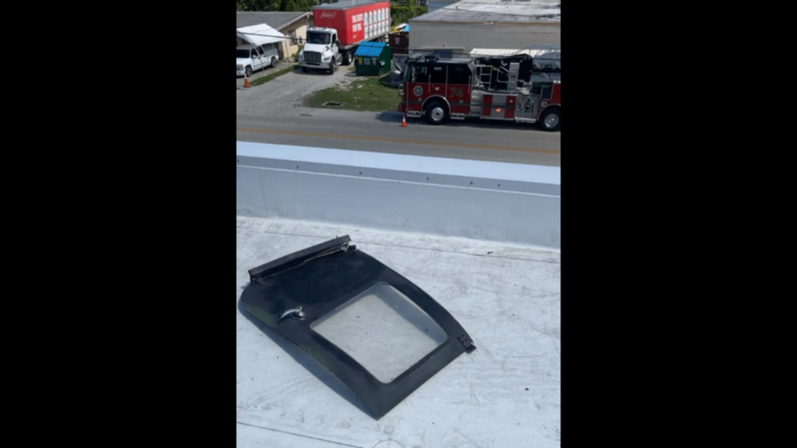 This door fell on the roof of a furniture store Wednesday, Aug. 2, in Fort Myers, Florida, officials said.