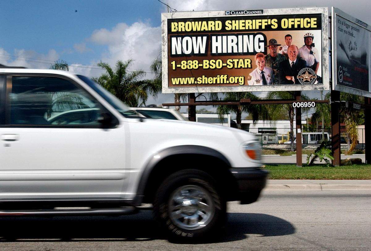 In 2003, a Broward County Sheriff’s Office billboard at the corner of Biscayne Boulevard and Northeast 54th Street in Miami advertises job openings.