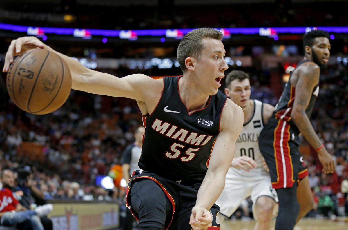 Miami Heat forward Duncan Robinson (55) controls the ball from going out of bounds in the fourth quarter in a March 2 game against the Nets.