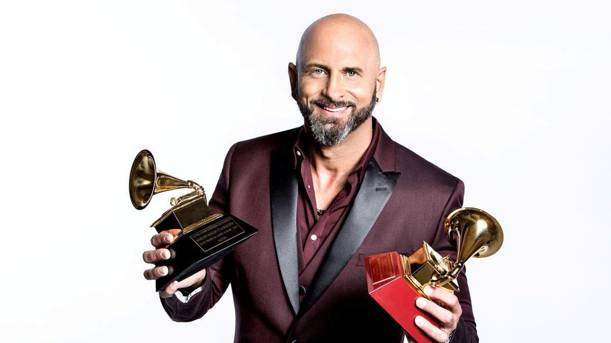Marlow Rosado, seen here with his Grammy and Latin Grammy awards, is promoting two new albums, both born during the coronavirus lockdown.