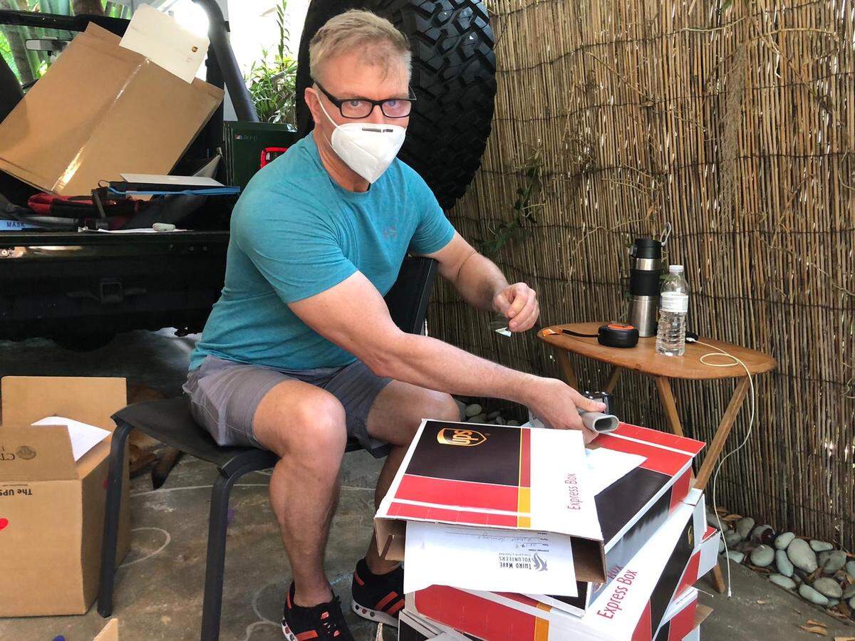 Third Wave Volunteer Dave Cook helps pack N95 masks for shipping all over the United States as part of the Women in White N95 Mask Drive.