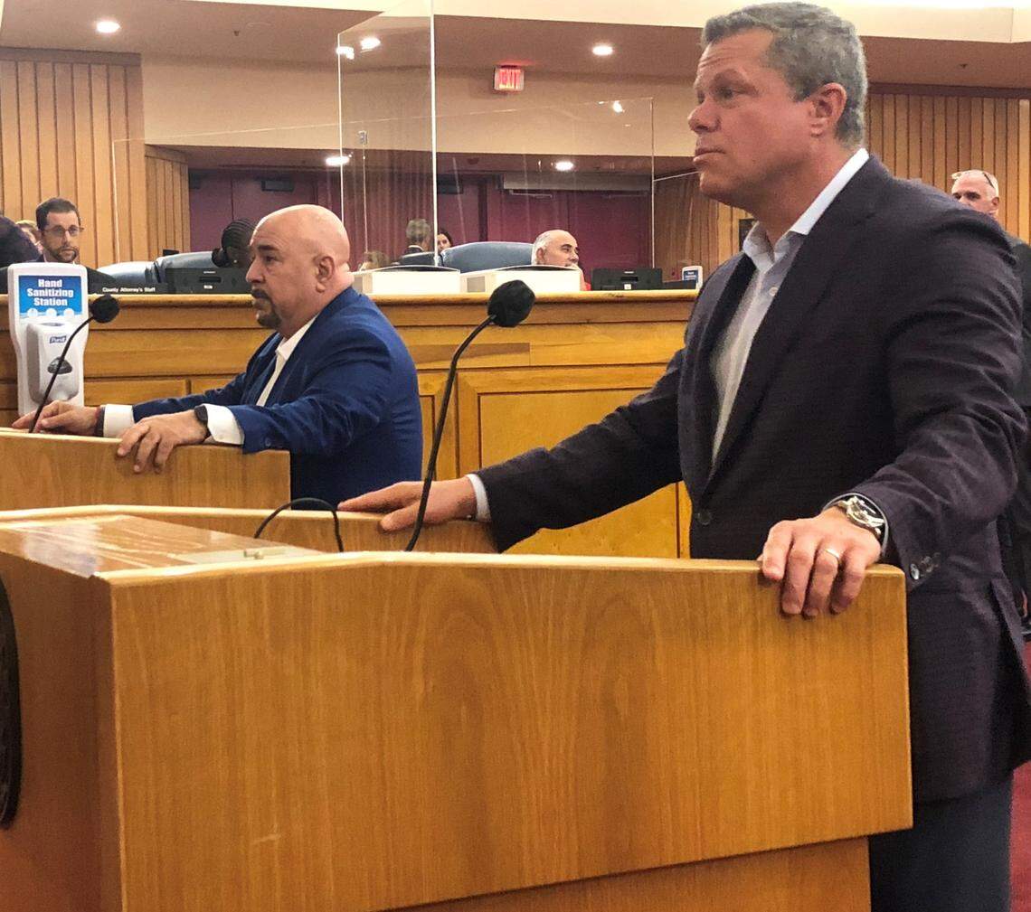 Brian May, foreground, a lobbyist for Duty Free Americas, and Chris Korge, an owner of the Newslink stores, address Miami-Dade County commissioners on Wednesday, Nov. 10, 2021. Commissioners gave preliminary approval of a relief package for Duty Free, Newslink and other businesses renting space at Miami International Airport.