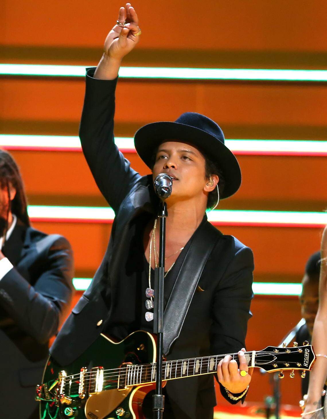 In this file photo from Feb. 19, 2013, Bruno Mars performs at the 55th Annual Grammy Awards in Los Angeles. He has two songs on the current March 2026 Billboard Top 10 that could be just right for driving. Or too fast.
