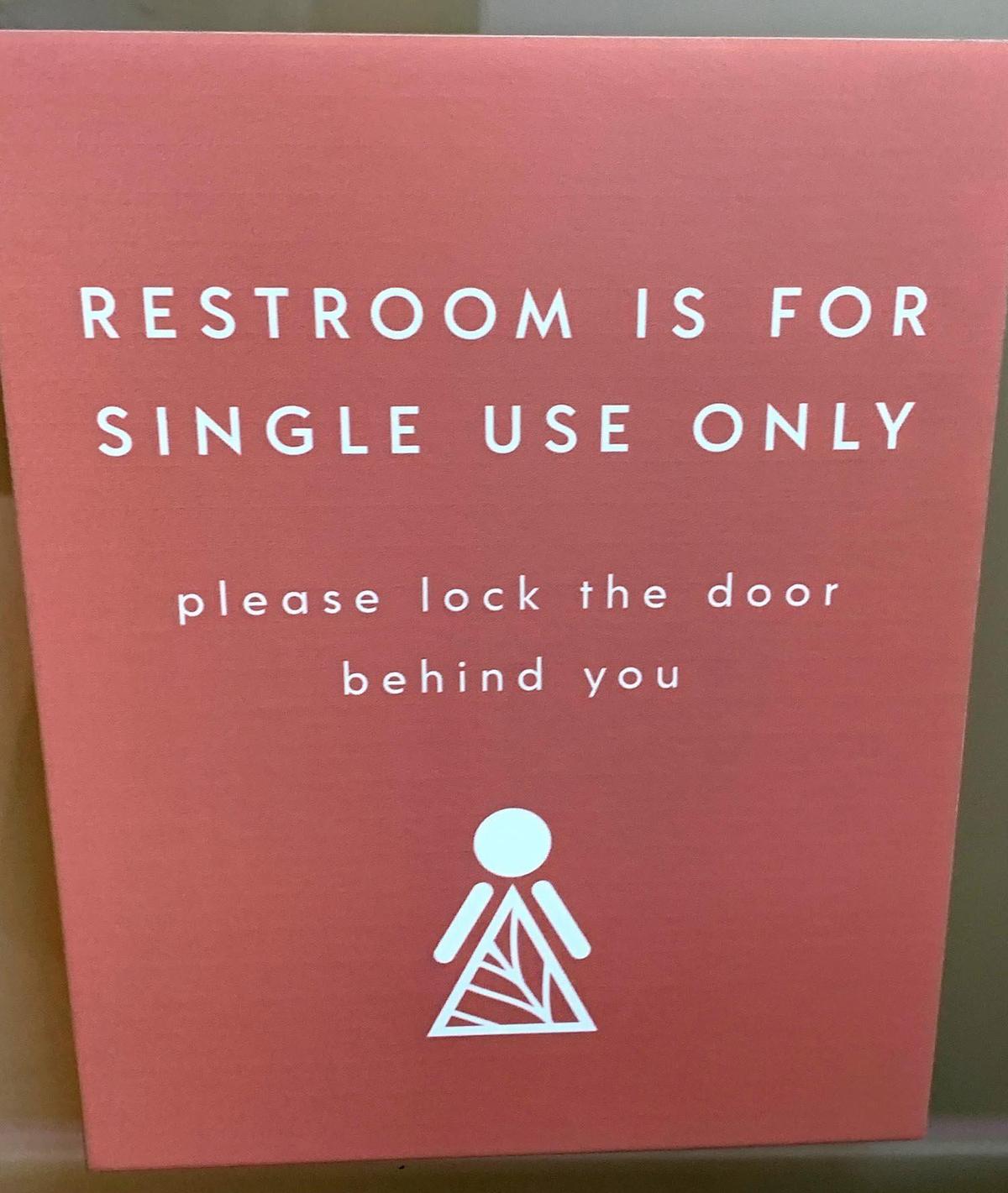A sign outside the bathroom at Planta restaurant in Miami Beach restricts the bathroom to one person at time.