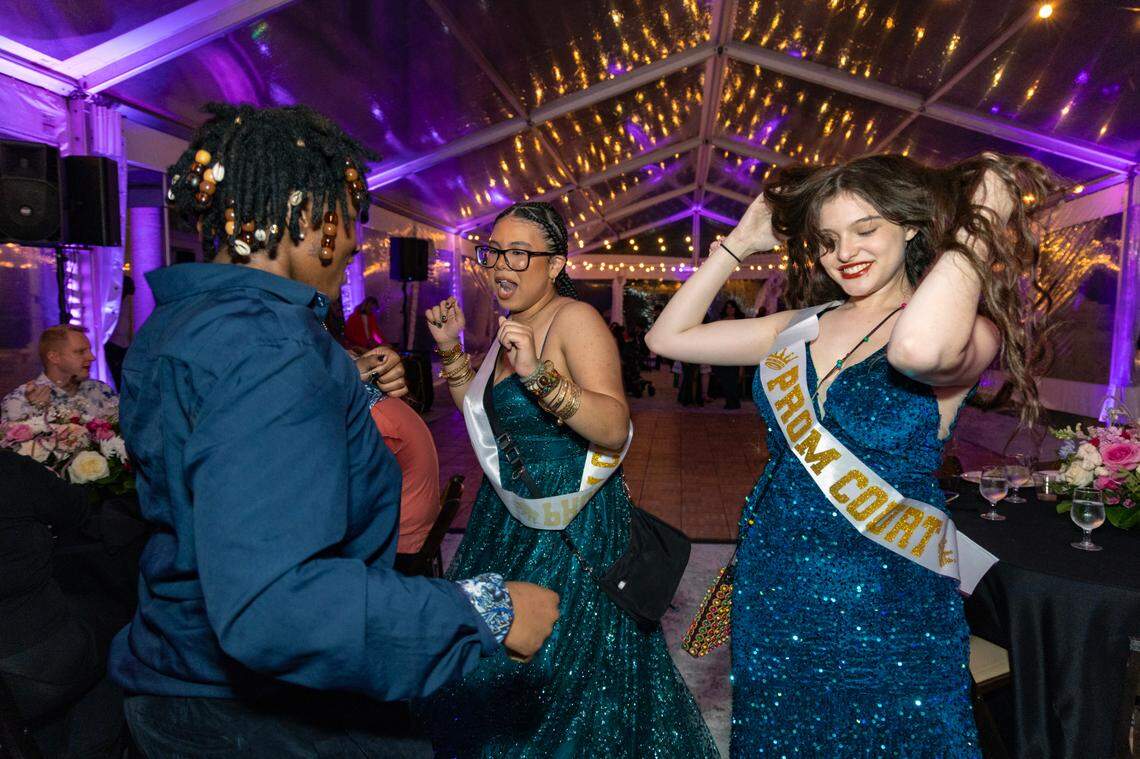 High school students, Eris Coney, 18, Zeniah Ellis, 16, and NIcole De Souza, 18, seen left to right, dance together during Safe Schools South Florida’s prom for queer youth/ The event provided students with the full prom experience in a welcoming and affirming space at the Vizcaya Museum and Gardens in Miami, Florida, on Saturday, May 31, 2025.