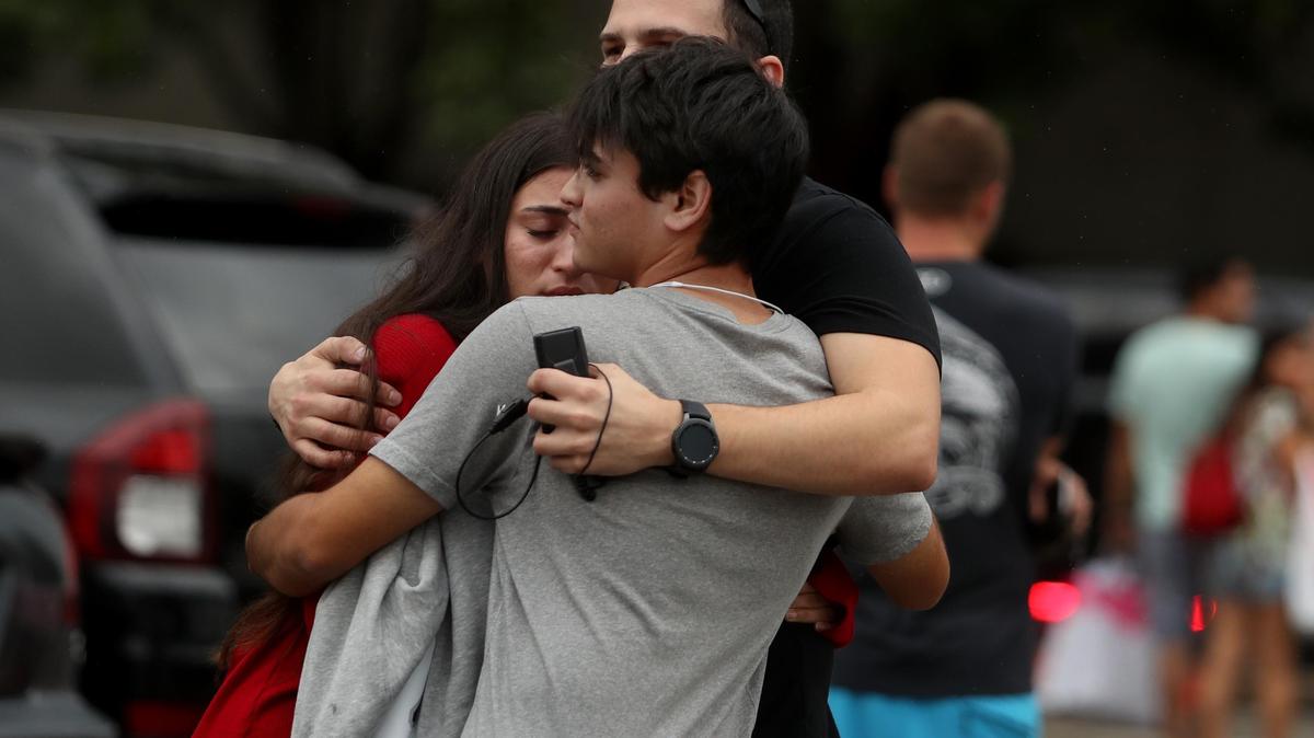 People comforts each other at the Boca Raton Town Center mall after reports of an active shooter on Sunday October 13,2019. ...SOUTH FLORIDA OUT; NO MAGS; NO SALES; NO INTERNET; NO TV...