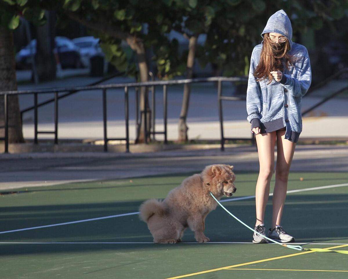 Residents of Miami’s Edgewater neighborhood stroll with friends, pets, and children at Margaret Pace Park wearing hoodies, sweaters, and cool weather attire as seasonal cool air arrived in South Florida on Tuesday, Dec. 1, 2020.