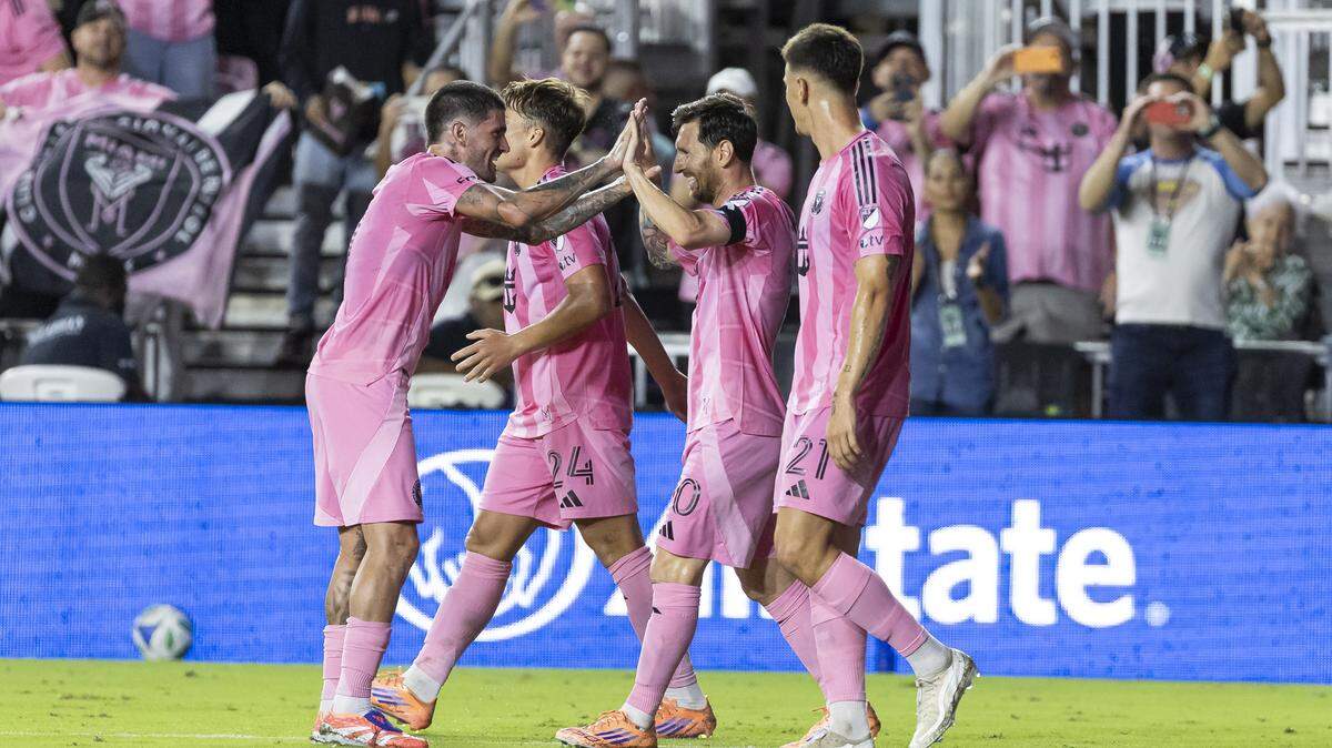 Inter Miami forward Lionel Messi (10) celebrates with midfielder Rodrigo de Paul (7) after scoring against Nashville SC in the first half of match three of their MLS Playoffs series at Chase Stadium on Saturday, Nov. 8, 2025, in Fort Lauderdale, Fla.