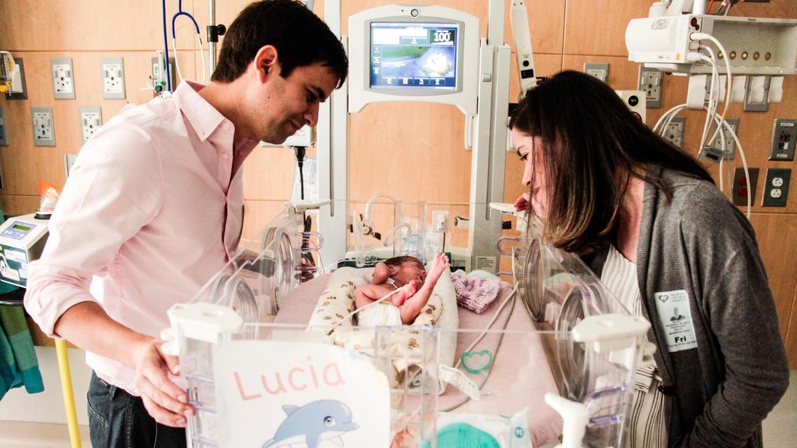 Paul and Sagri watch over one of their quadruplet daughters at Nicklaus Children’s Hospital ‘s new Fetal Care Center’s Special Delivery Unit. The 10-bed unit, which opened in June, is for mothers who will be delivering high-risk infants.