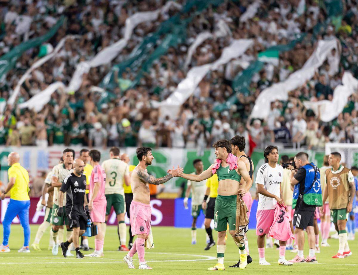 Inter Miami forward Lionel Messi (10) shakes hands with Palmeiras defender Giay Agustin (4) after their Group A third-round FIFA Club World Cup soccer match at Hard Rock Stadium on Monday, June 23, 2025, in Miami Gardens, Fla.