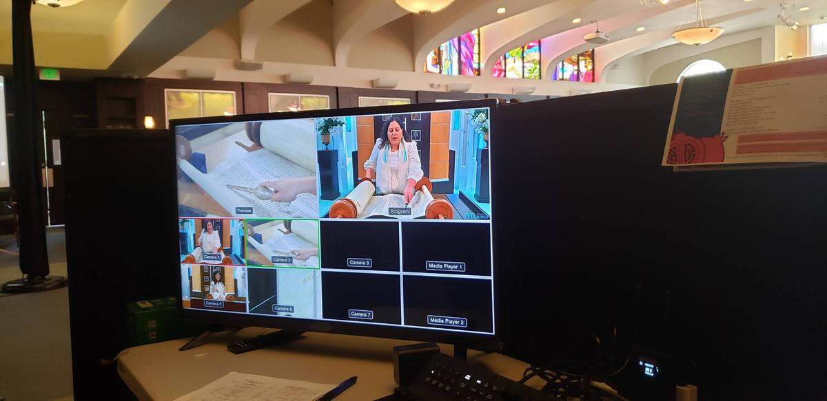 Gaby Enser Tangir, Temple Judea B’nai Mitzvah director, reads from the Torah during a recent service that was livestreamed.