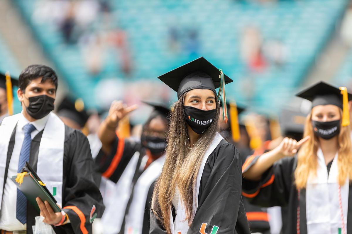 Students sit at one of the commencement ceremonies of the University of Miami held at the Hard Rock Stadium in Miami Gardens on Friday, May 14, 2021.