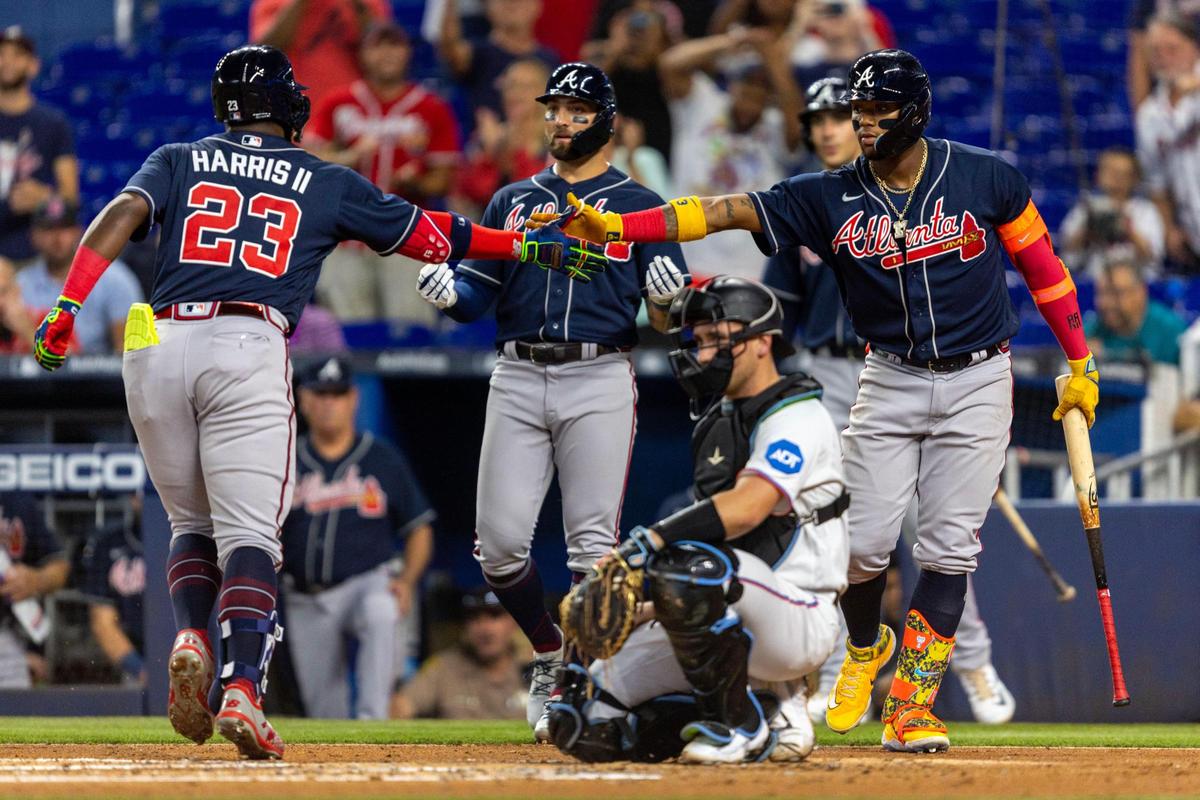 Atlanta Braves base runner Michael Harris II (23) reacts with teammate Ronald Acuna Jr. (13) after homering during the second inning of a MLB game against the Miami Marlins at loanDepot Park, in Miami, Florida, on Wednesday, May 3, 2023.