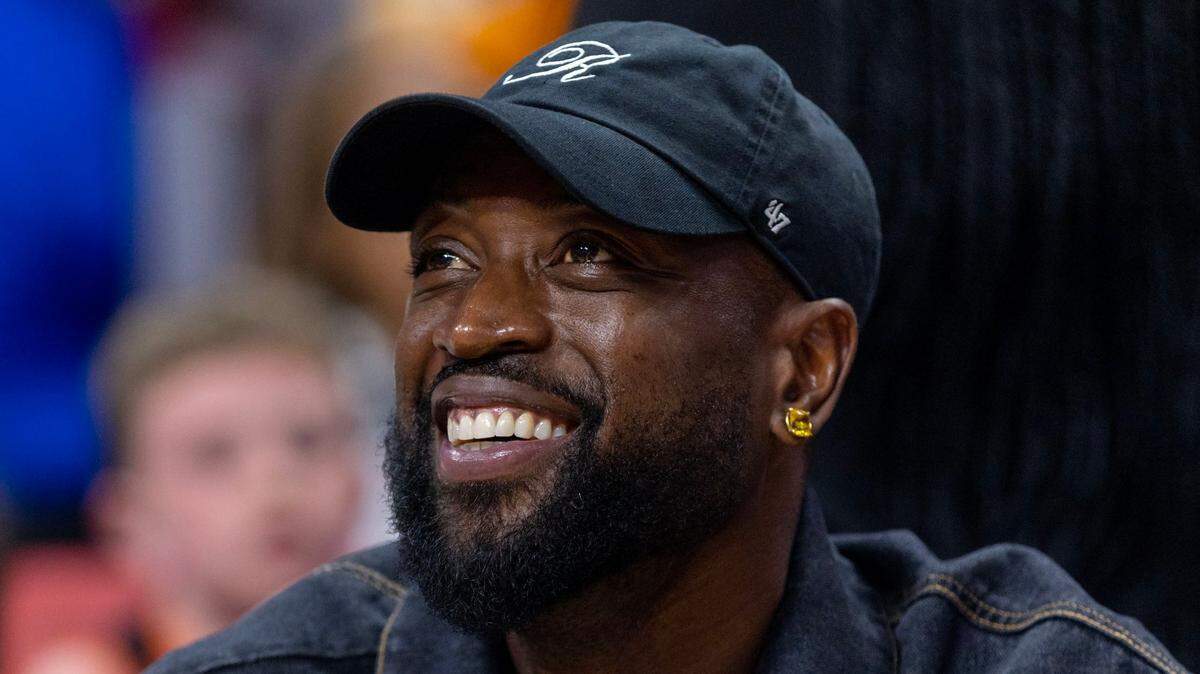 Former Miami Heat player Dwyane Wade reacts from court side during the second quarter of an NBA game between the Heat and the Knicks at Miami-Dade Arena Downtown Miami, Florida, on Wednesday, March 22, 2023.