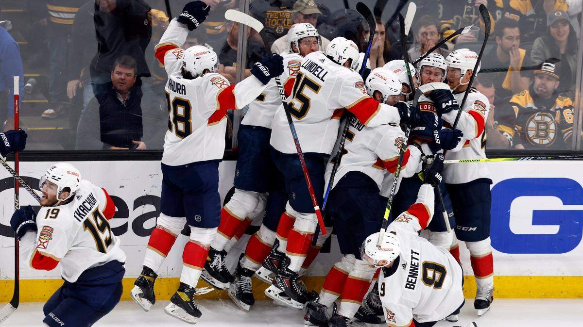 The Florida Panthers celebrate after defeating the Boston Bruins on a goal by Carter Verhaeghe in overtime during Game 7 of an NHL hockey Stanley Cup first-round playoff series, Sunday, April 30, 2023, in Boston. (AP Photo/Michael Dwyer)