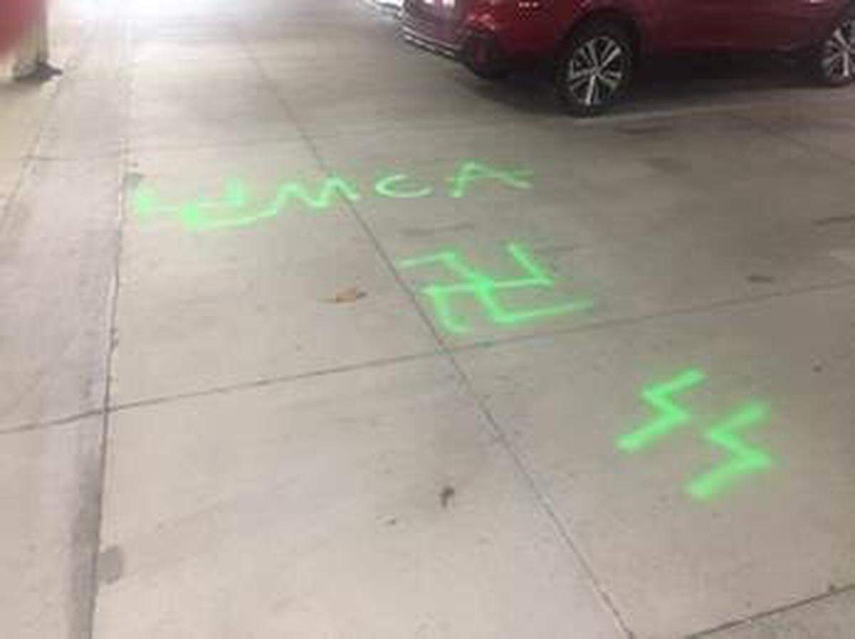Someone spray-painted a swastika and SS lightning bolts on the ground of a condominium parking garage in Tampa. The case is one of 91 anti-Semitic incidents in Florida in 2019, according to the Anti-Defamation League.