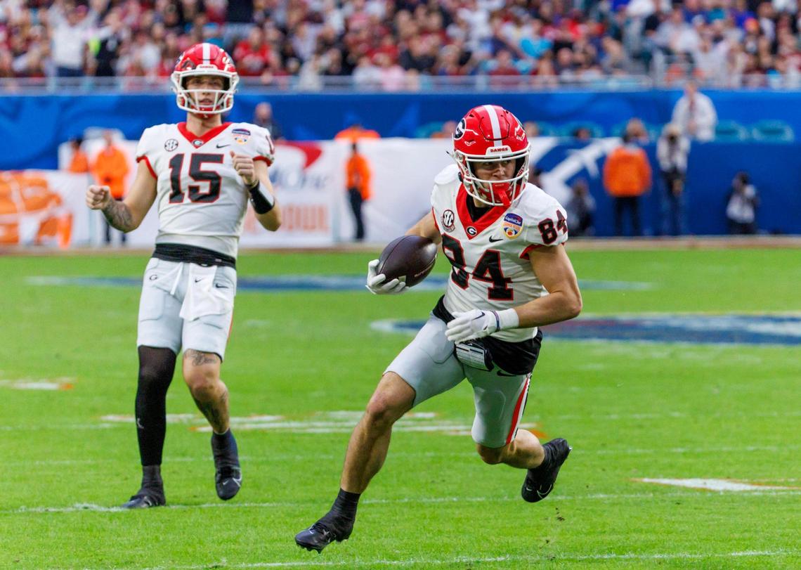 Georgia Bulldogs wide receiver Ladd McConkey (84) runs for a touchdown during the second half of the 90th annual Capital One Orange Bowl against the Florida State Seminoles at Hard Rock Stadium on Saturday, Dec. 30, 2023 in Miami Gardens, Fla.