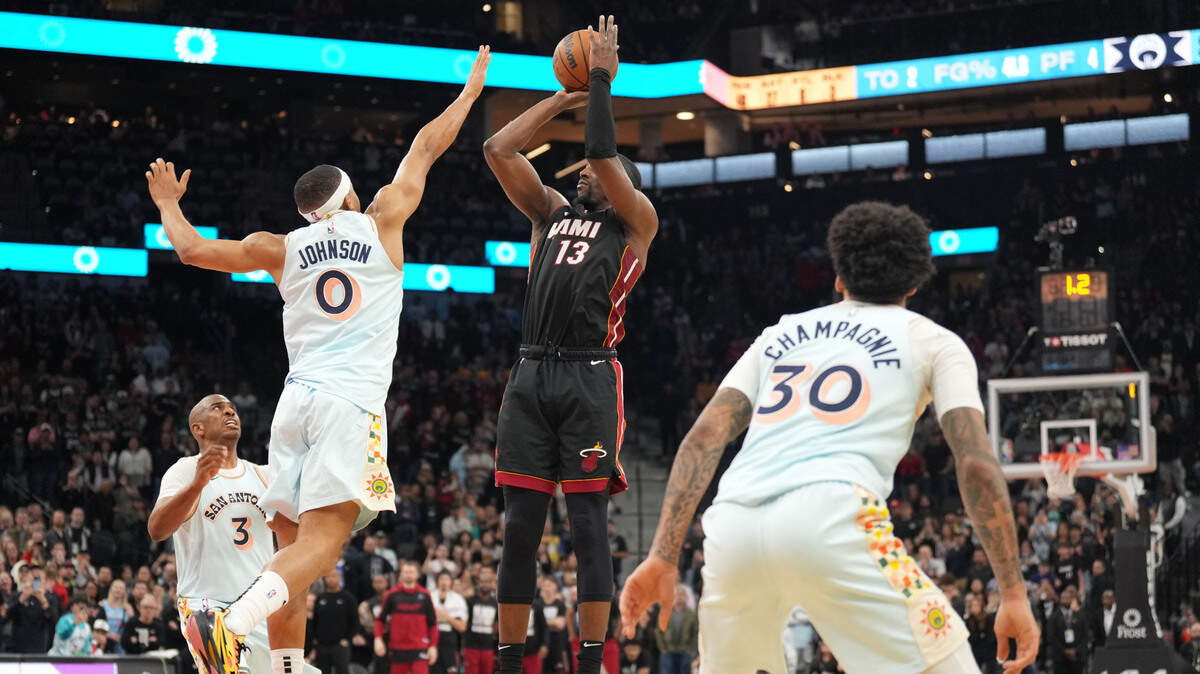Miami Heat center Bam Adebayo (13) scores the winning basket at the end of the game to defeat the San Antonio Spurs at Frost Bank Center.