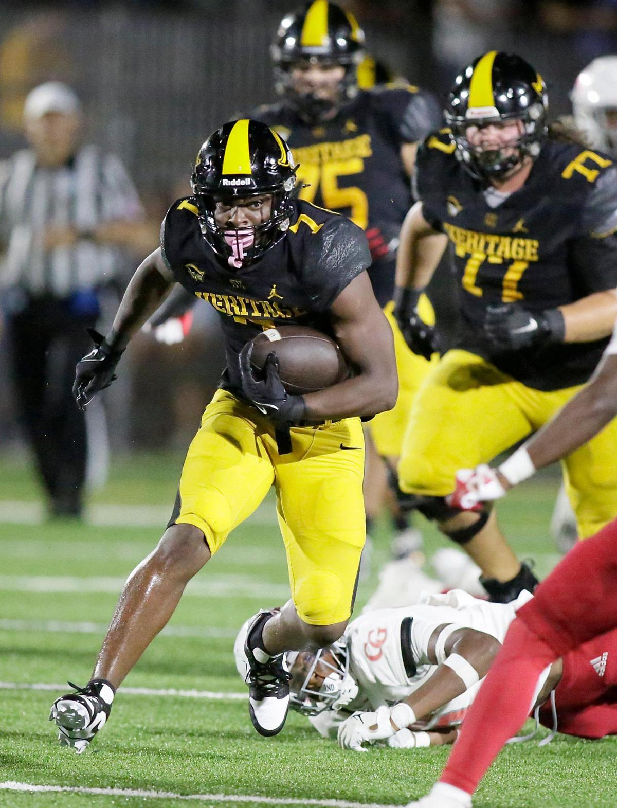 American Heritage running back Byron Louis (7) runs the ball against Cardinal Gibbons Chiefs during the football game on Friday, September 29, 2023 at American Heritage HS in Plantation. Andrew Uloza / for Miami Herald