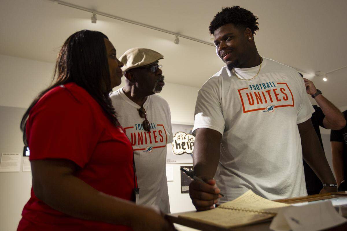 Miami Dolphins’ defensive tackle Jamiyus Pittman (65)  interacts with an exhibit inside of the Freedom Tower during the team’s Football Unites: Cultural Tours event on Tuesday, September 18, 2018. The event unites Miami Dolphins players, alumni and staff with community leaders and law enforcement to experience the cultural diversity of South Florida.