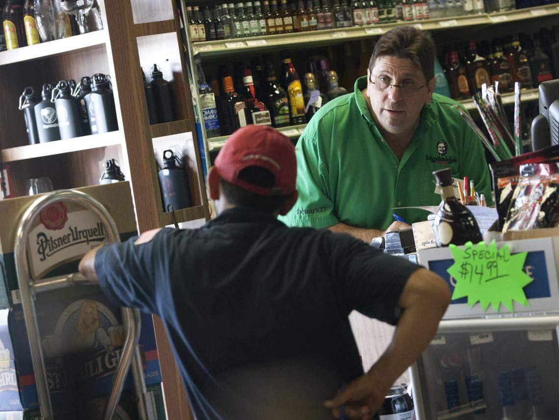 Store manager Jay Miller takes a delivery at the big Daddy’s Liquor store in Hallandale Beach on April 5, 2011.