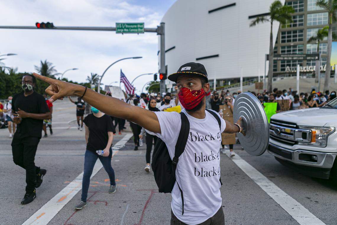 Joseph Martinez, 28, a member of Dream Defenders, directs a crowd of activists during a ‘Justice for George Floyd’ protest in downtown Miami on Monday, June 1, 2020.